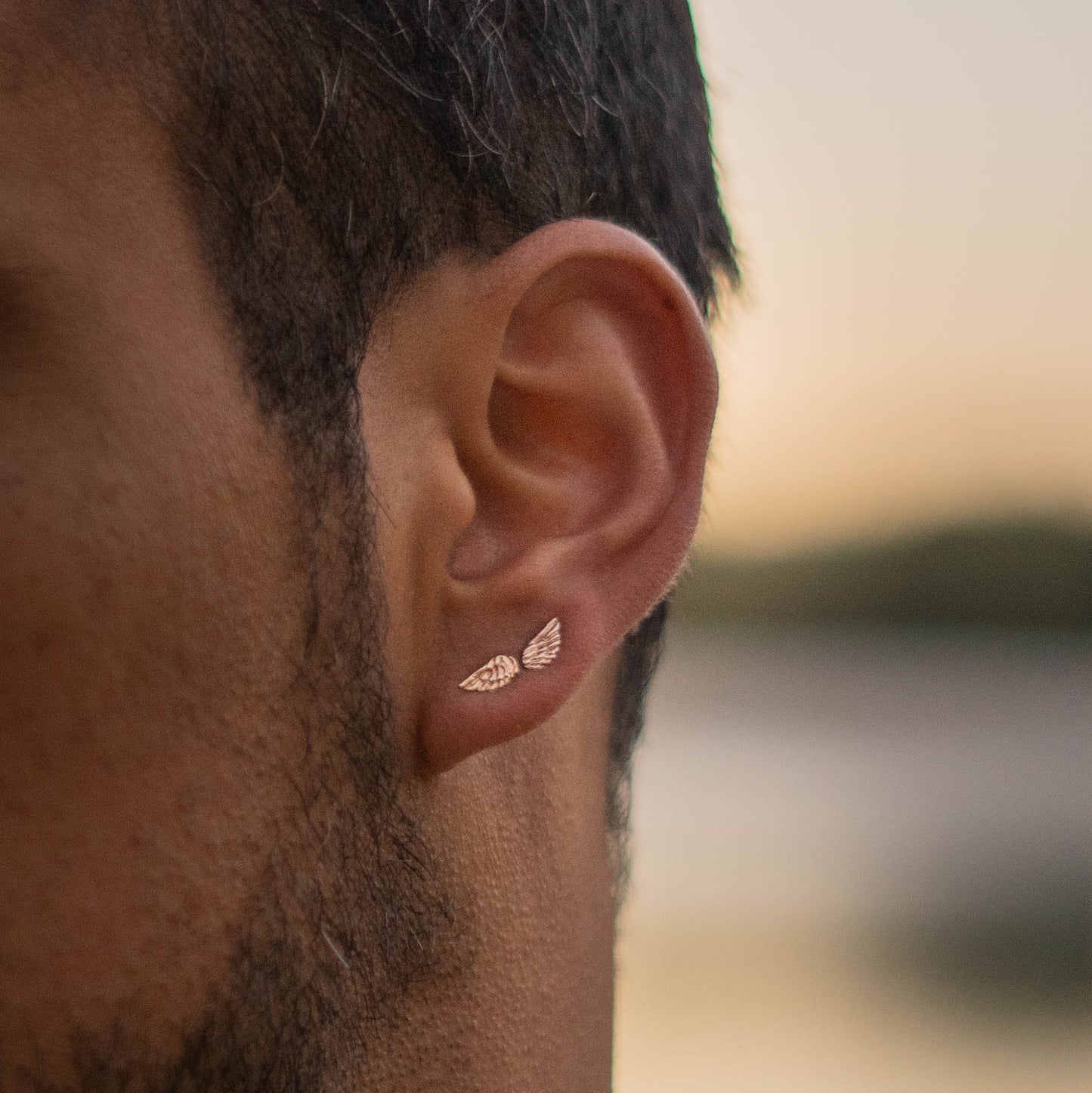 Arete ala izquierda baño oro rosa